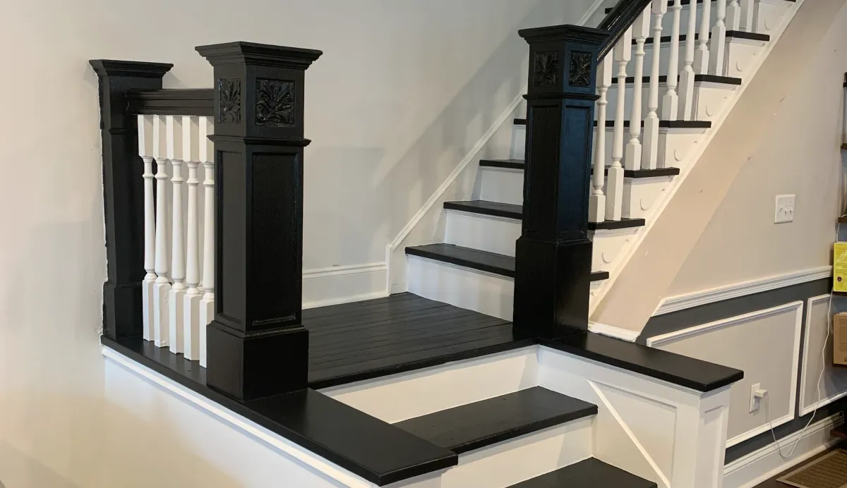 Restored historic staircase with original millwork and finished trim