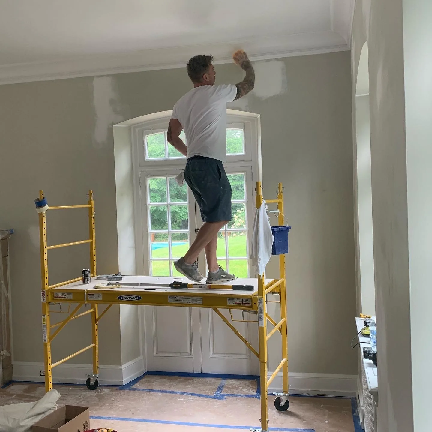 Painter preparing the walls of a historic interior