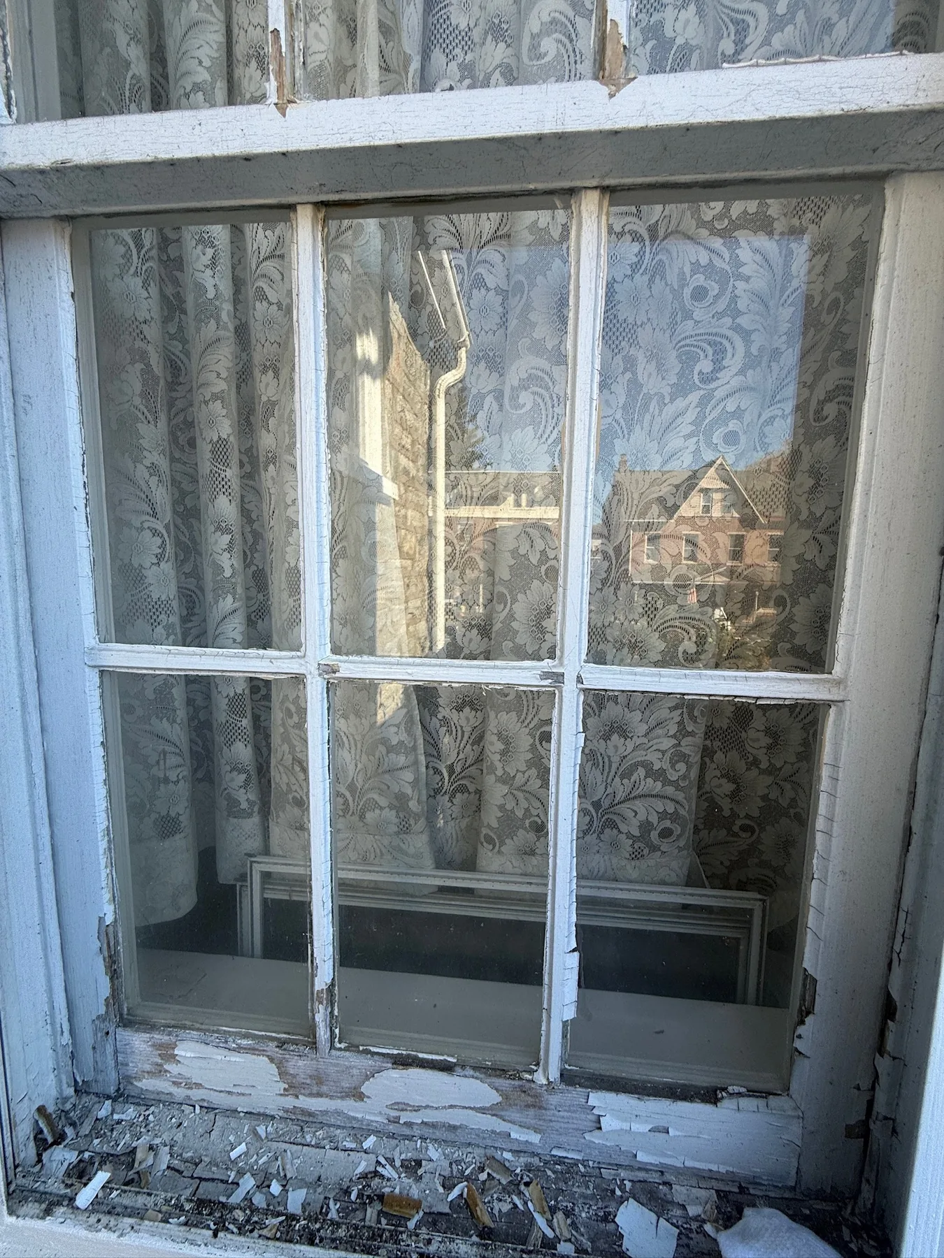 Weathered historic window before restoration