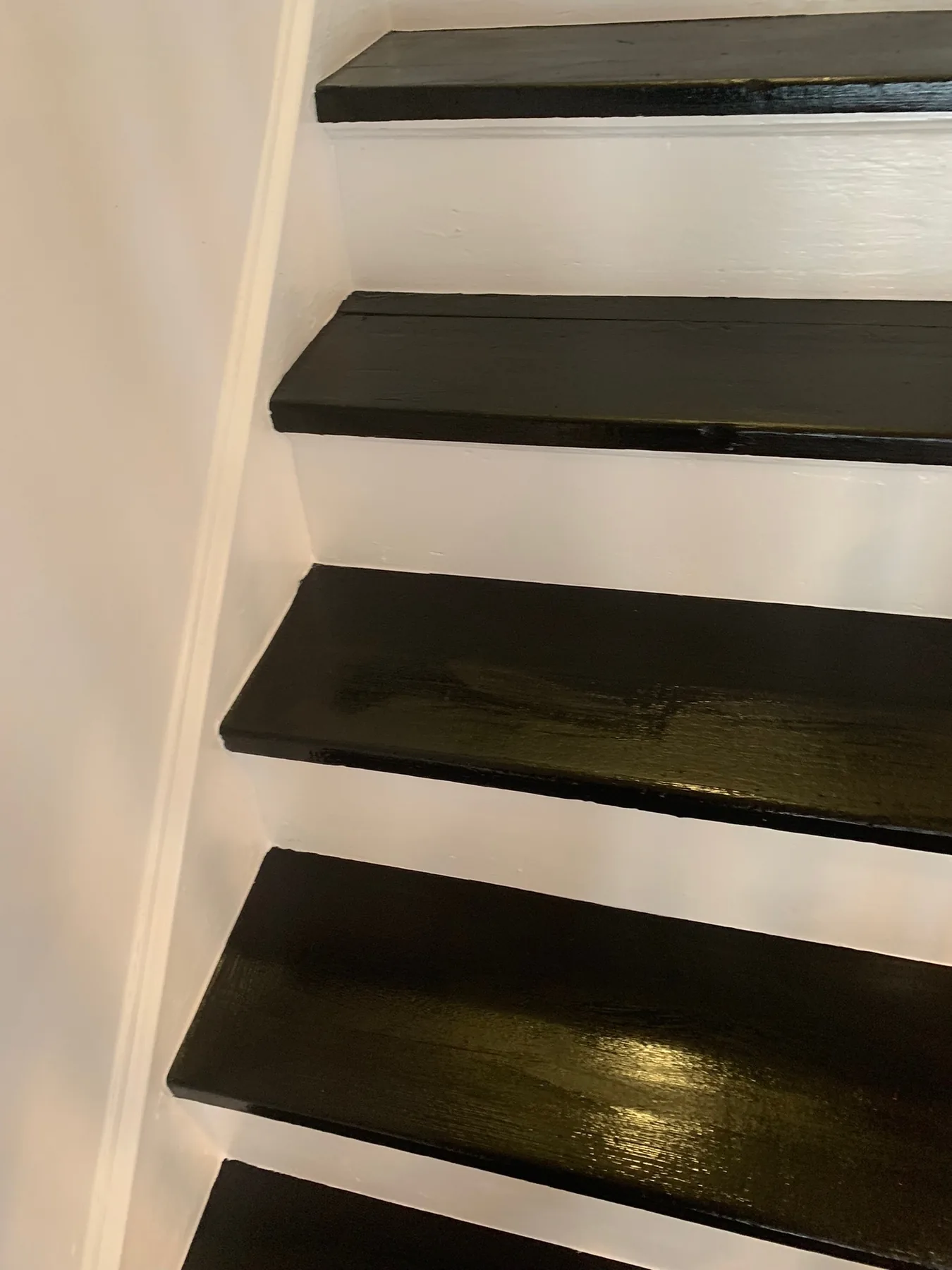 Crisp black stair treads with white risers