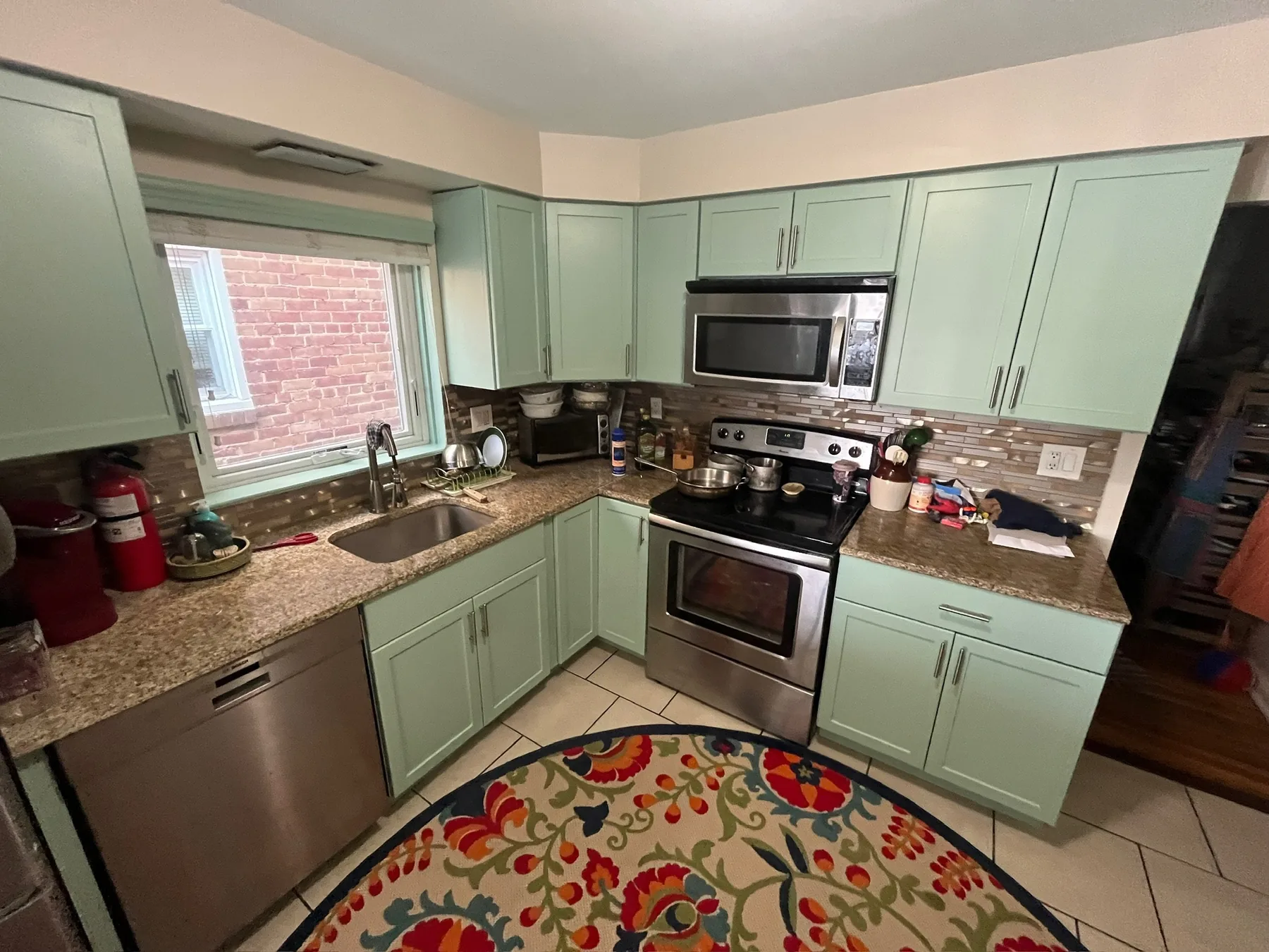 Kitchen cabinets after a pale green repaint
