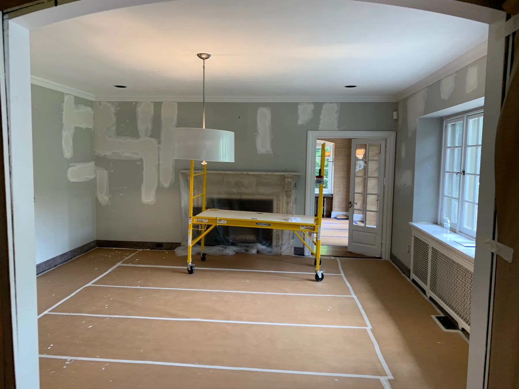 Protected floors and patched walls during preparation