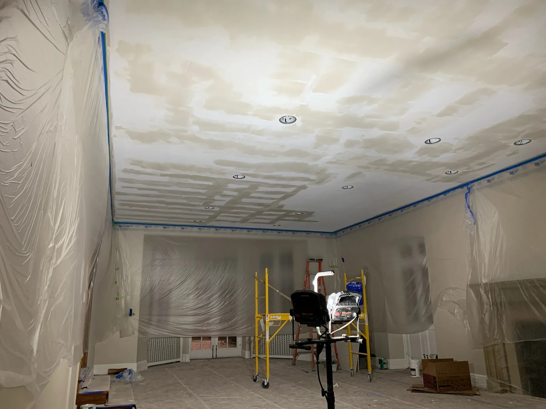 Ceiling and drywall preparation in progress