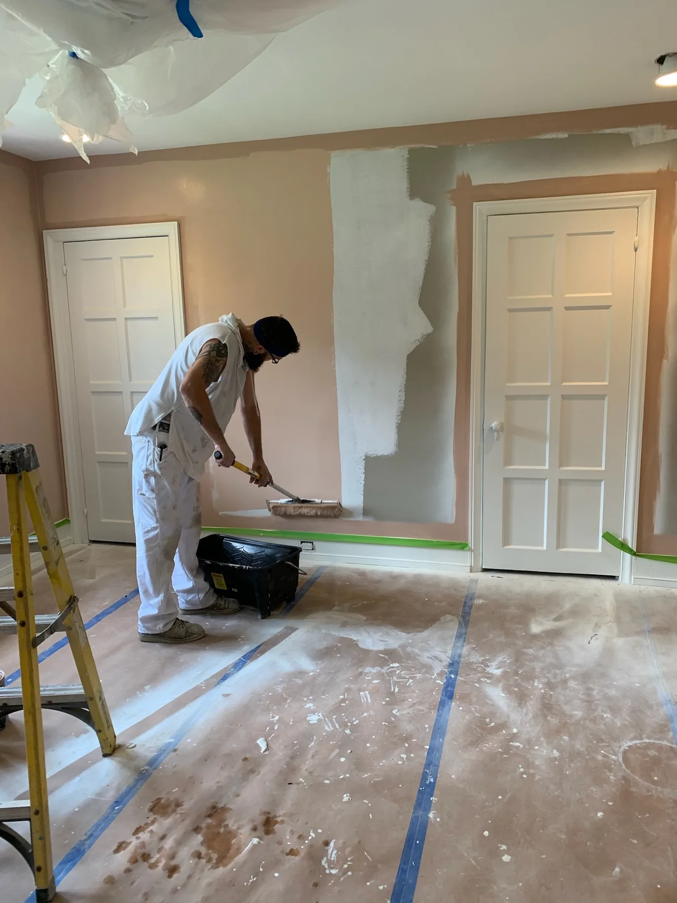 Painter applying an interior wall finish