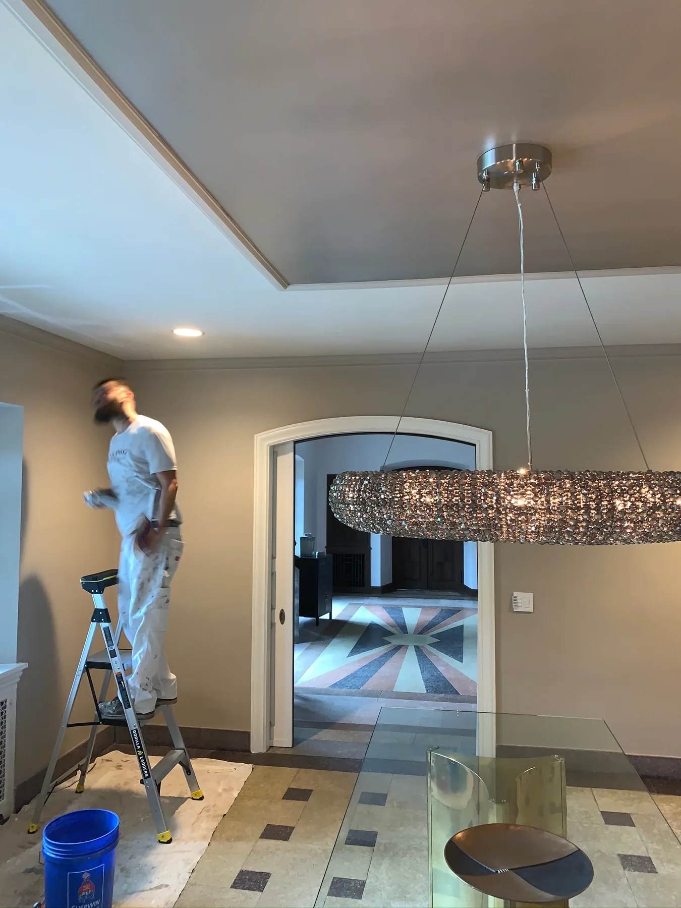 High-ceiling interior painting in progress