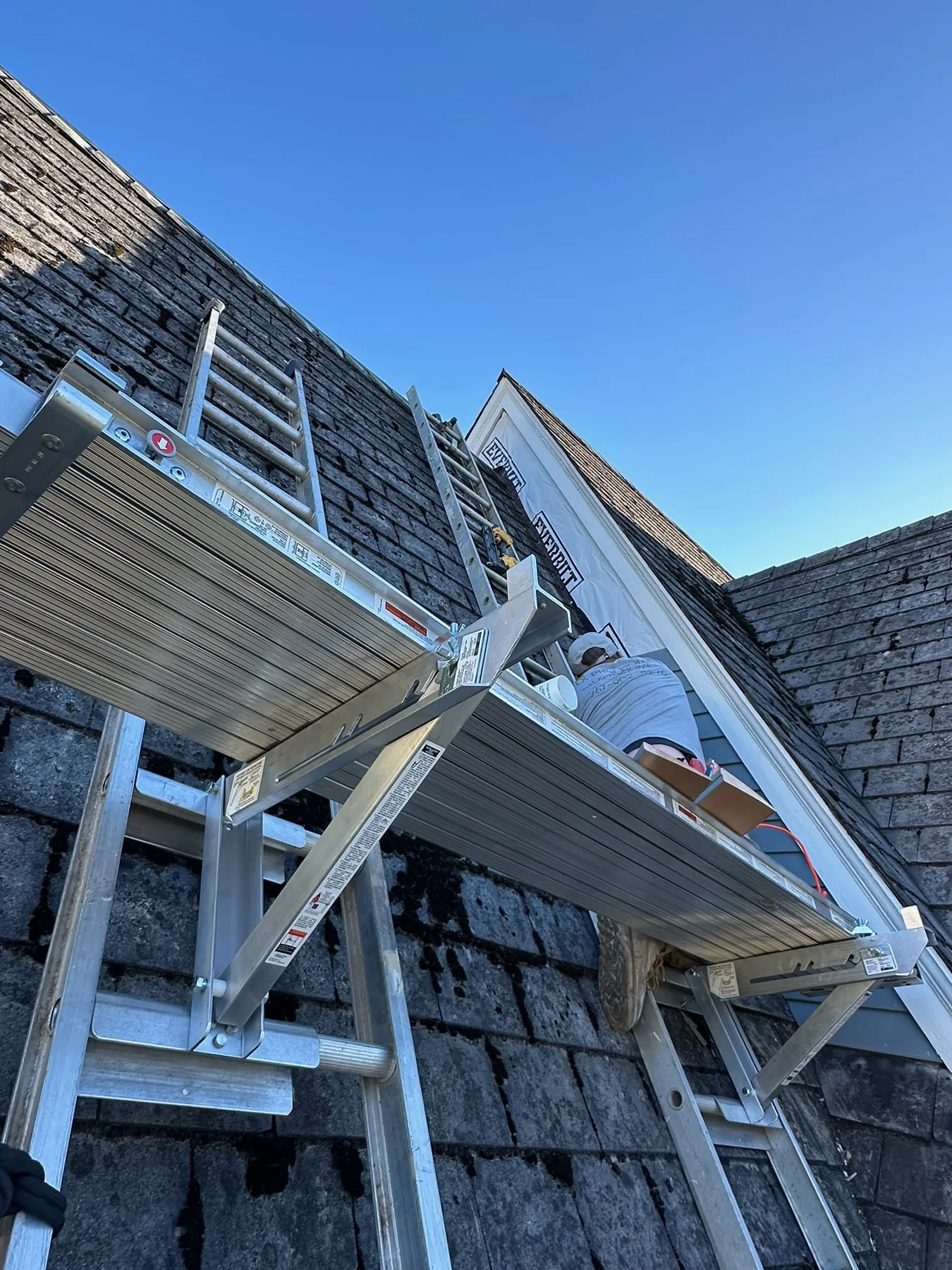 Exterior gable and trim painting in progress