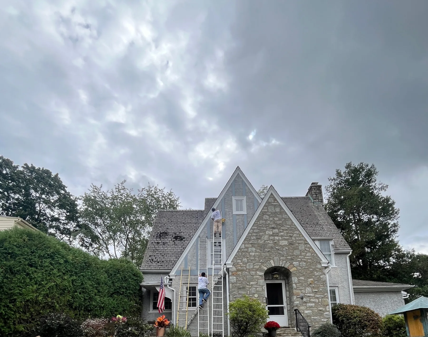 Wide view of exterior painting in progress