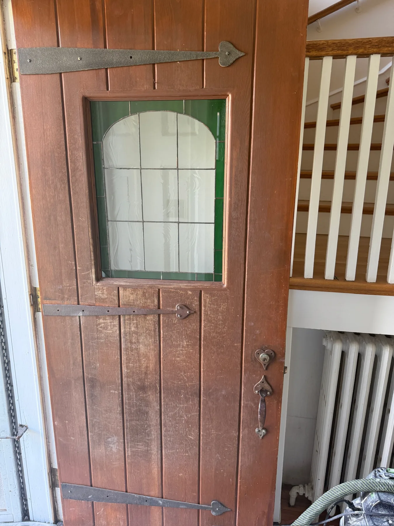 Weathered wood door before refinishing